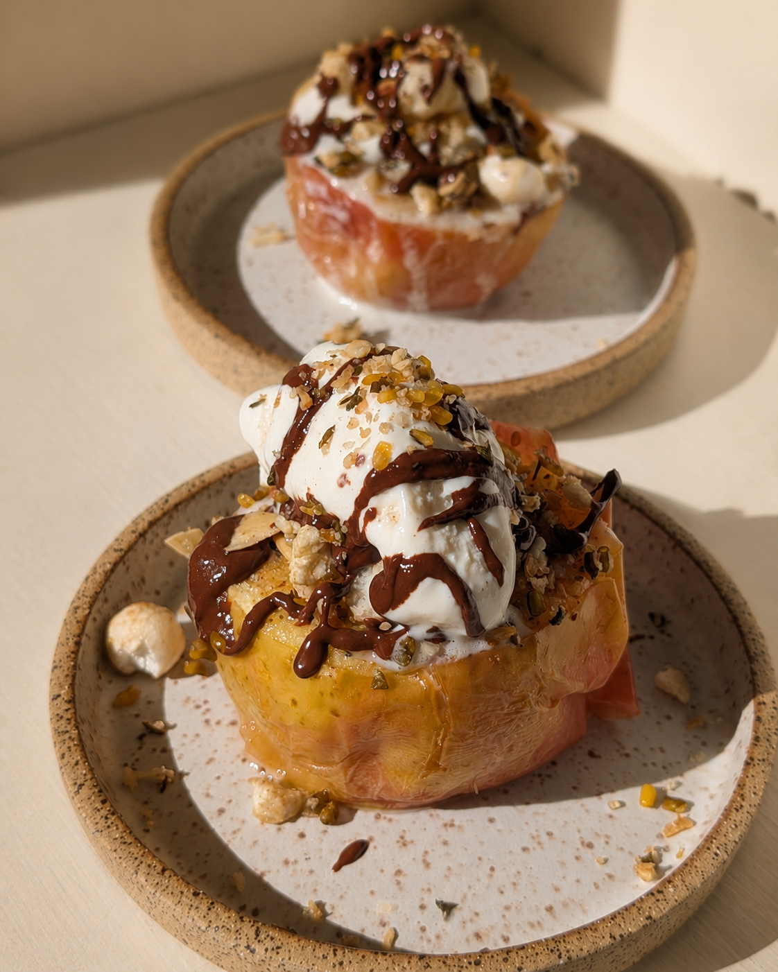Warm baked Honeycrisp apples filled with Babo’s Panjiri, vanilla ice cream and dark cacao drizzle.
