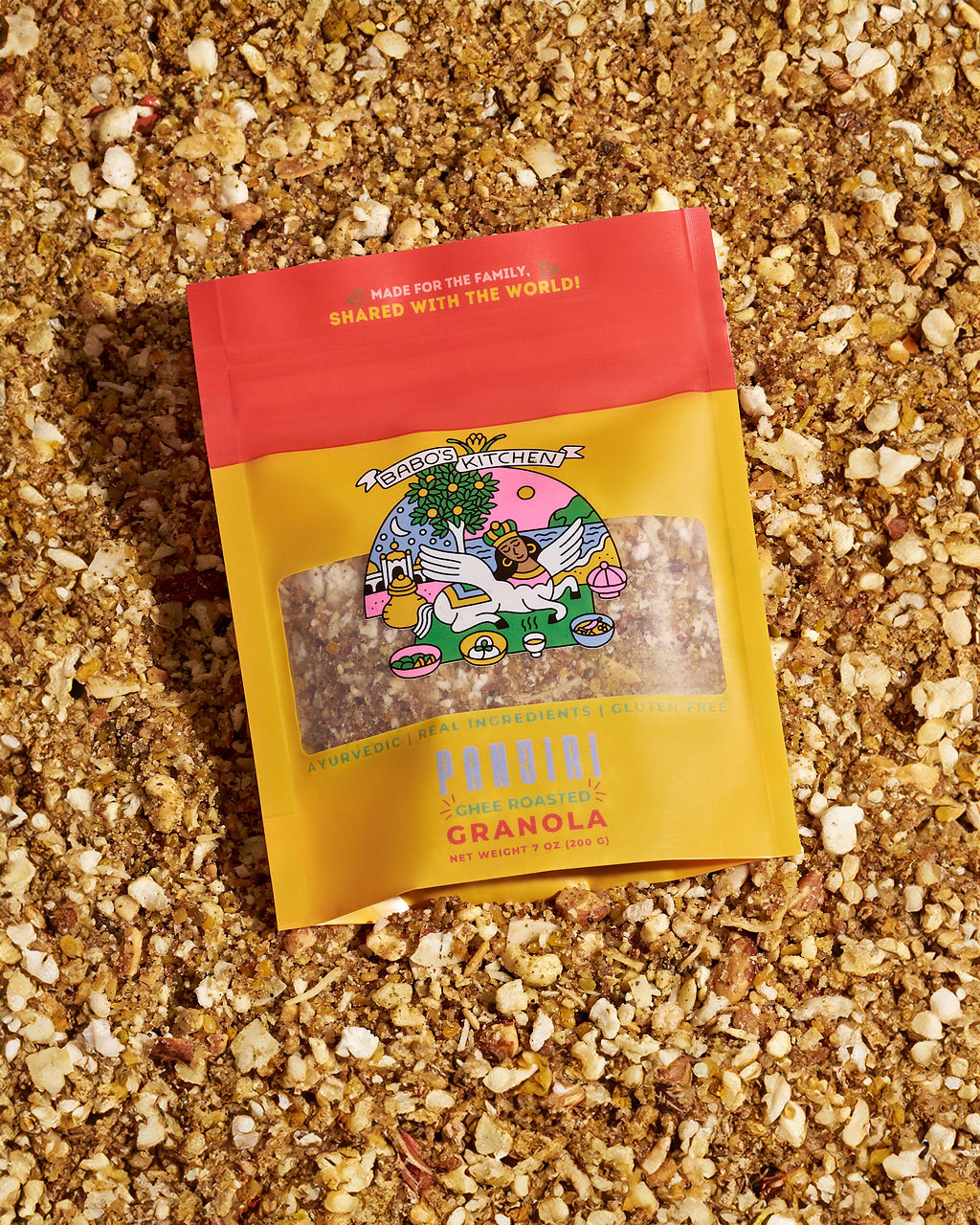 Babo's Kitchen Panjiri, a gluten-free roasted lentil snack, displayed on a bed of Panjiri made with nuts, seeds, coconut, and cardamom.