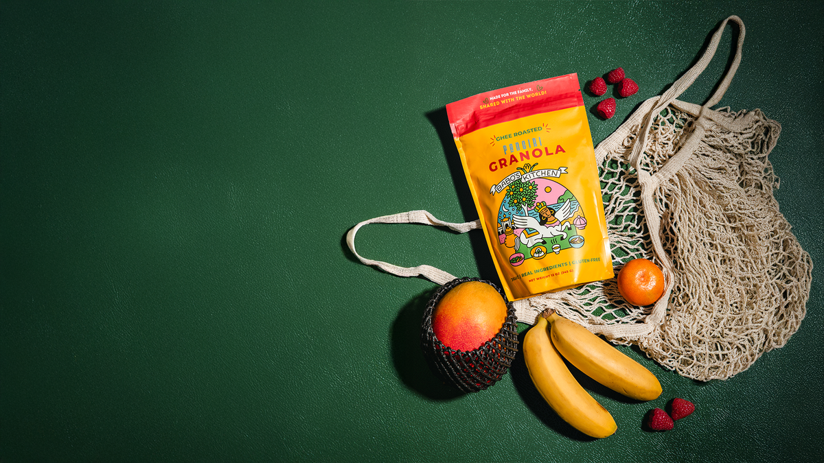 Babos Panjiri package with fruits and a reusable bag on a green background